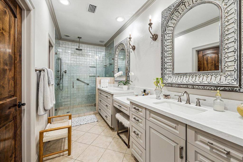 Second floor master bathroom. New countertops, mirrors, lighting, sinks, and hardware.