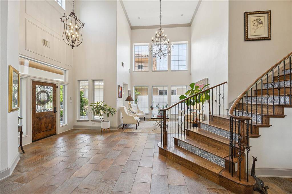 Main two story entry way open to the formal living room. All new light fixtures.