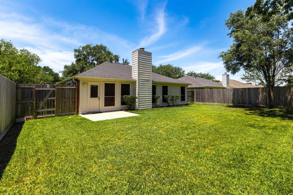 Spacious backyard with lush landscaping—perfect for outdoor enjoyment and relaxation.