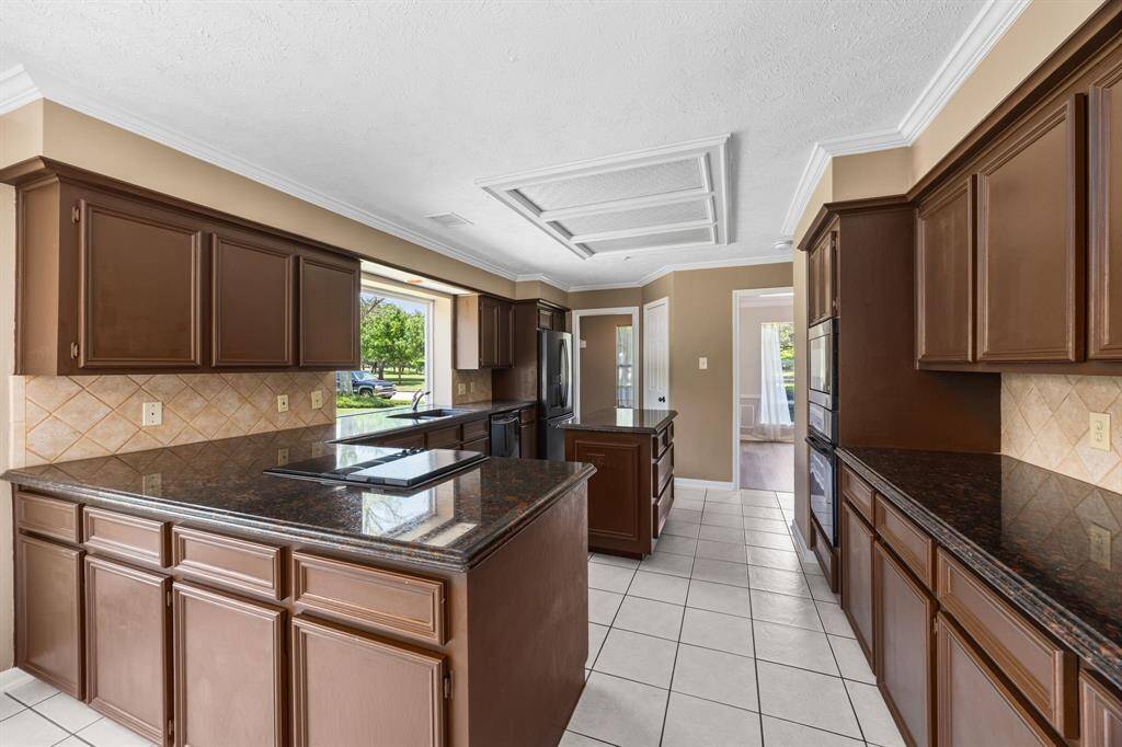 Island kitchen with plenty of cabinetry and counter space.