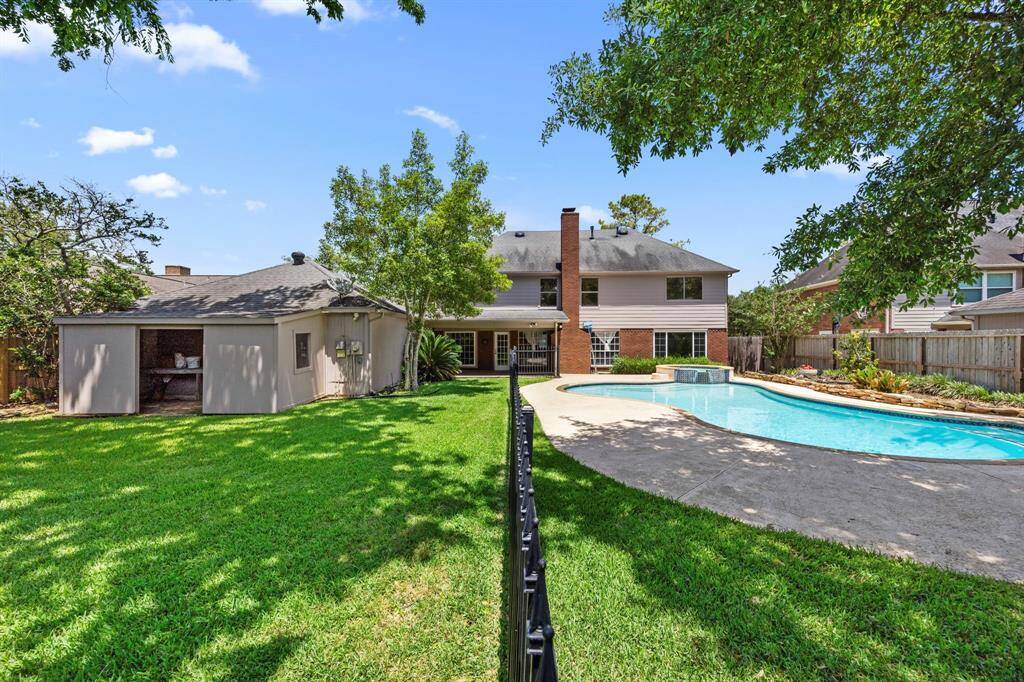 Pool is gated off as an added safety feature, with still plenty of yard to run and play.