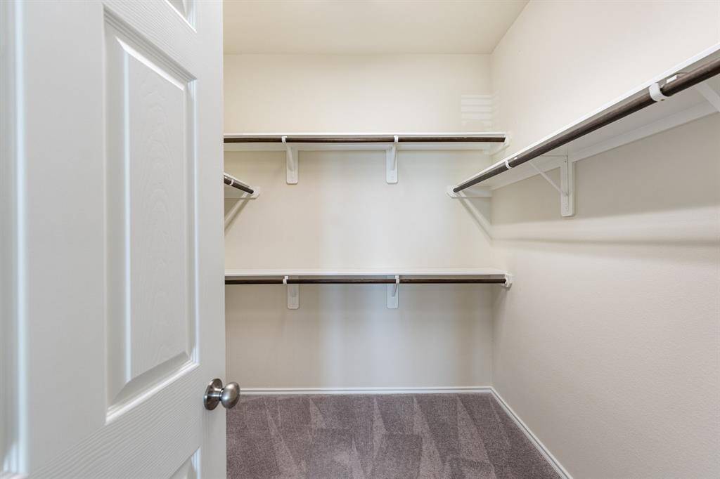 One of two oversized walk-in closets in the primary bedroom.