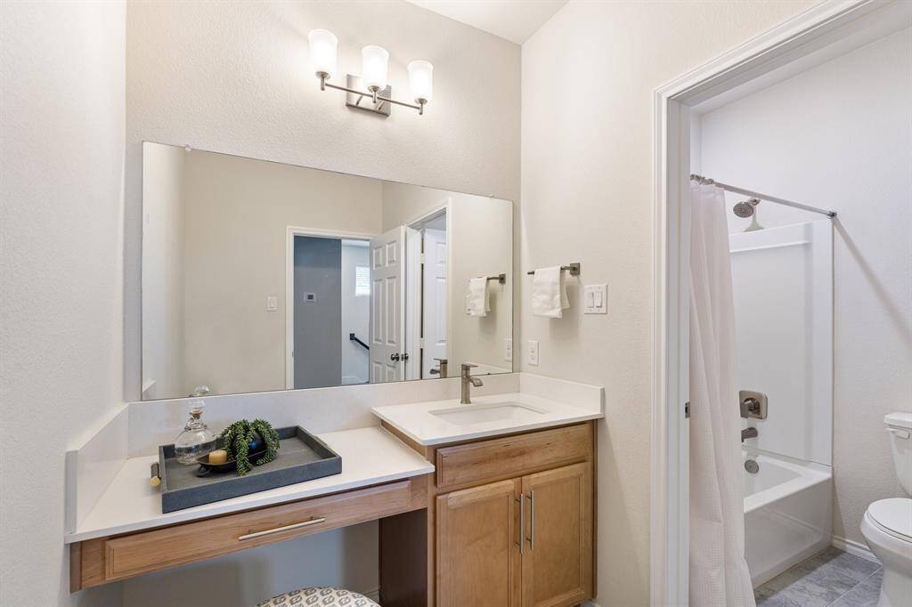 Full bathroom has a tub/shower combo and additional vanity space. Enjoy extra privacy with a door separating the sink and vanity from the bathroom.