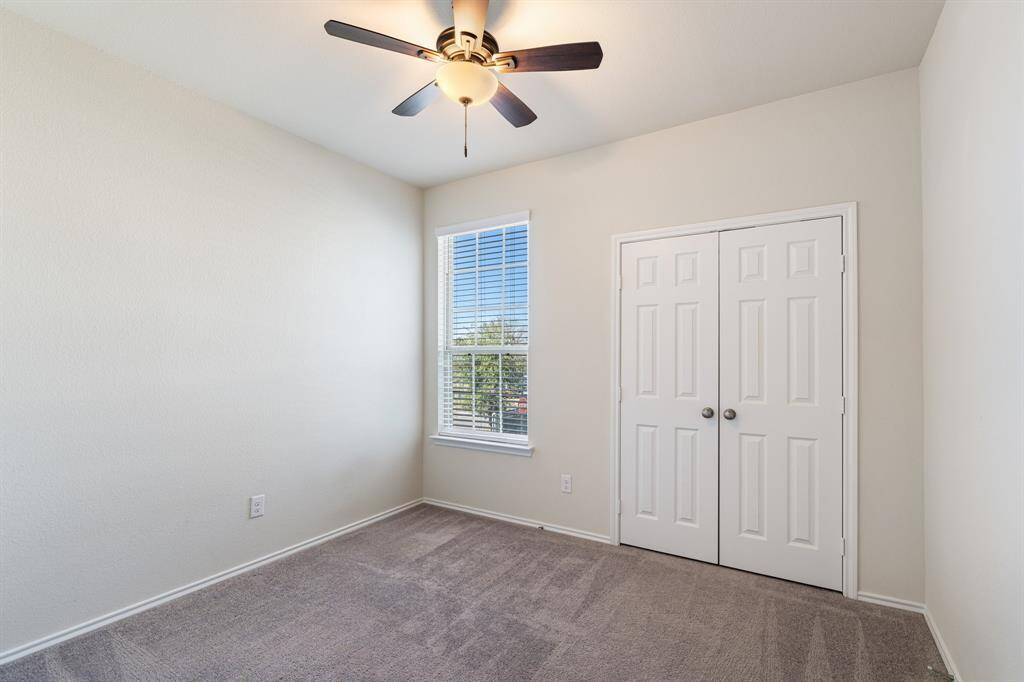 One of three bedrooms, perfect for a guest suite or private office space.