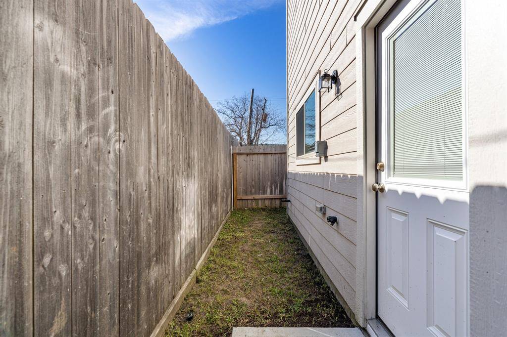 Fully fenced, private outdoor space with gate leading to large adjacent greenbelt.
