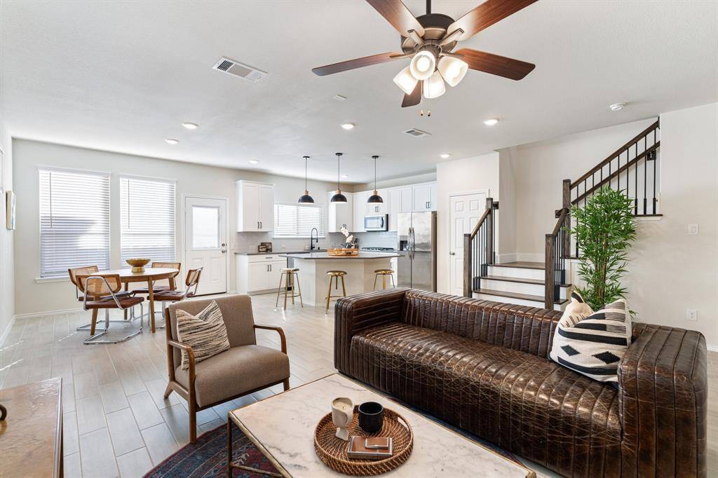The home is light and bright with numerous windows with coverings and recessed lighting throughout the home.
