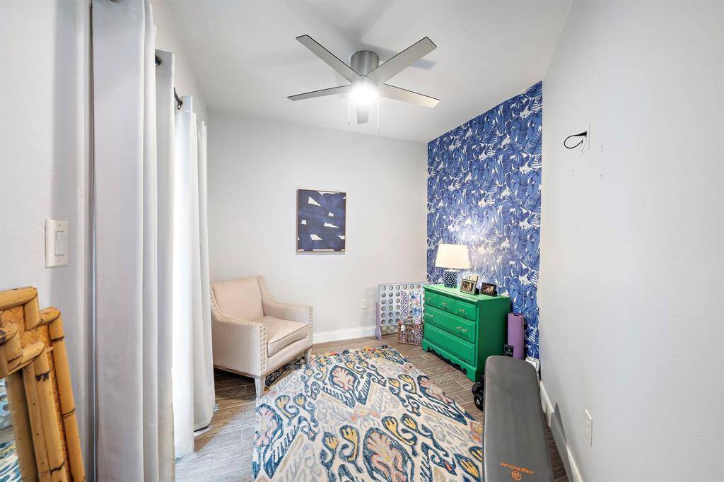 An adjoining flex room offers endless possibilities, whether you need a second office, a home gym, or a nursery.