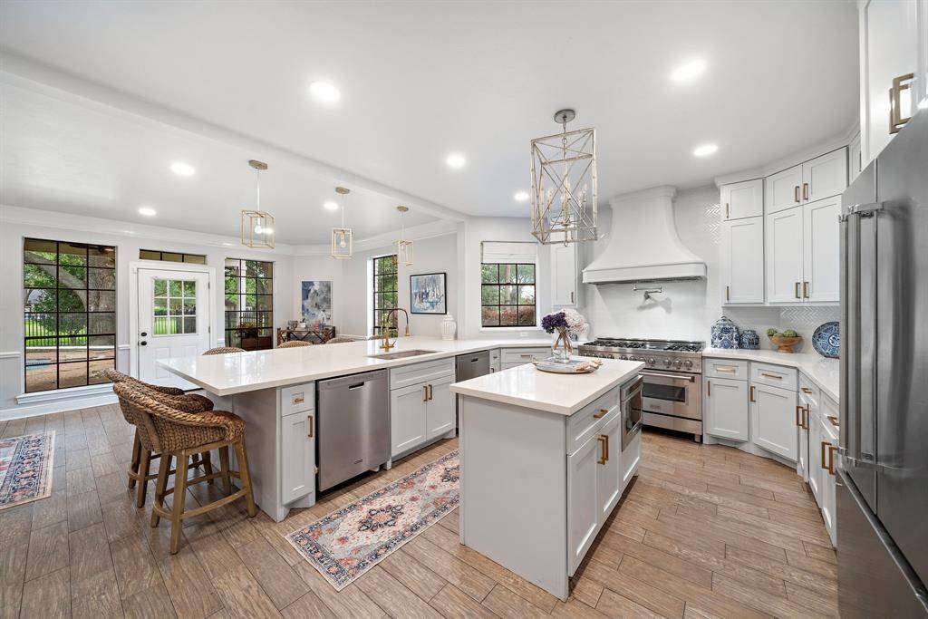 Recently transformed with meticulous attention to detail, this home showcases brand-new flooring throughout the main level, designer lighting, upgraded hardware, and fresh paint inside and out.