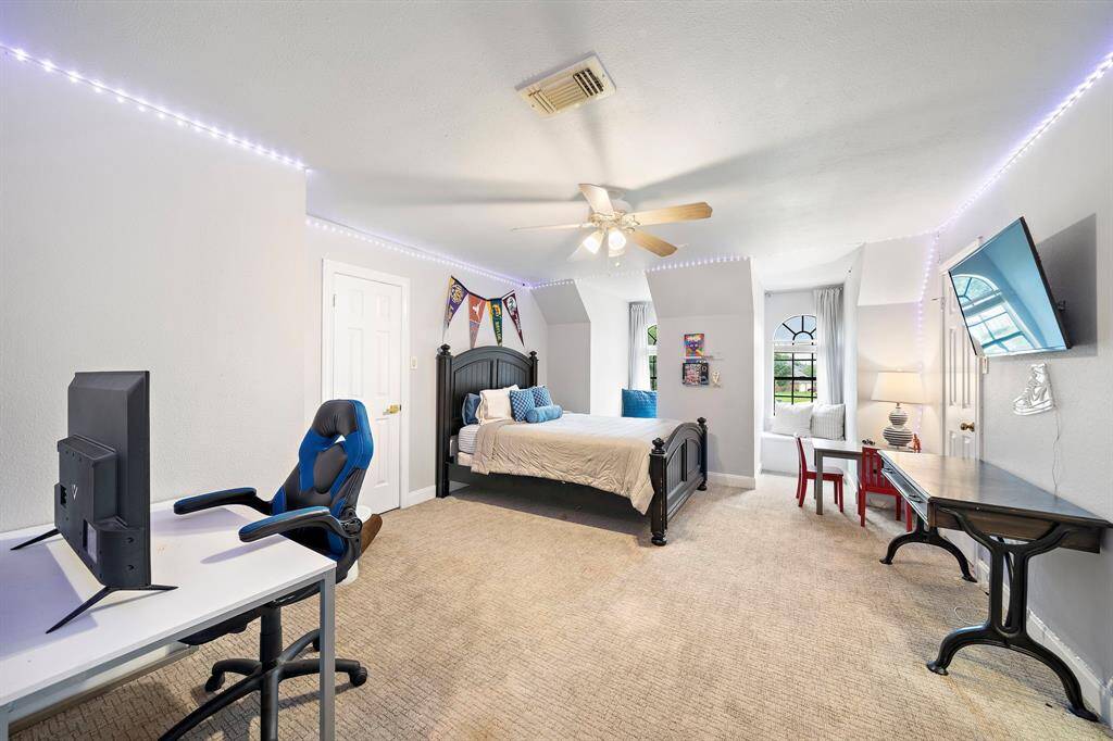 Another secondary bedroom with two closets and built-ins.