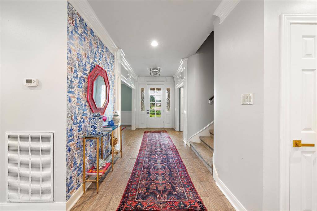 Custom wallpaper accents bring a touch of sophistication, making every room feel distinct yet cohesive.