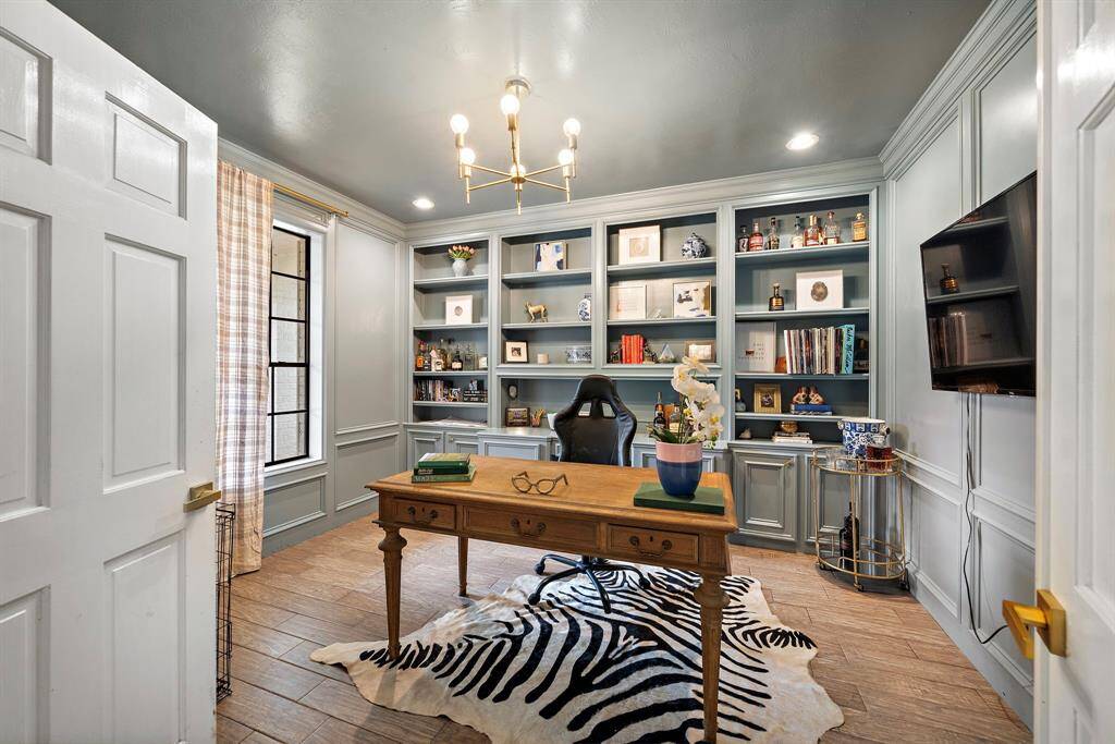The dedicated study, adorned with custom built-ins, offers a perfect setting for remote work.