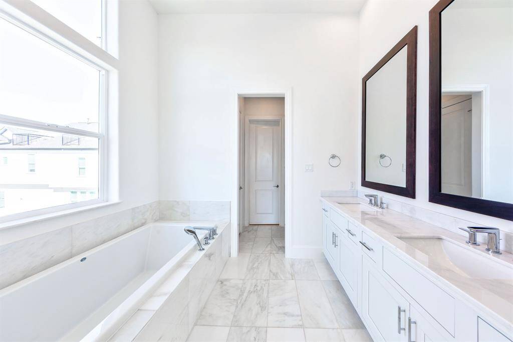 bright natural light primary bathroom