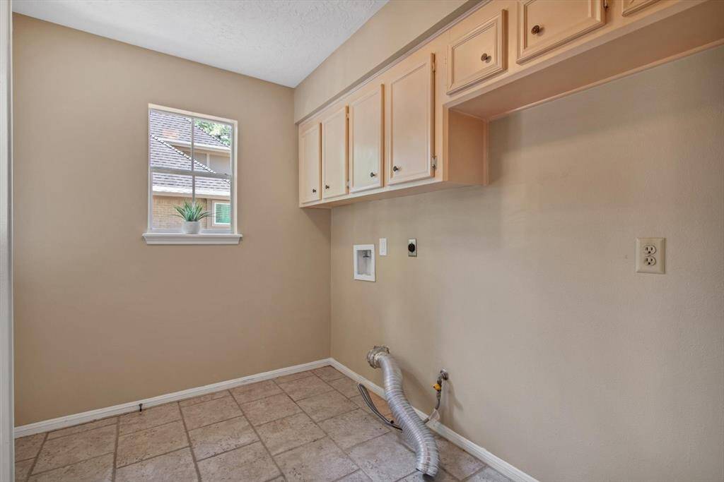 Guest half bath.  All the baths were remodeled with same granite counters, hidden European hinges, and shaker cabinets in 2014.