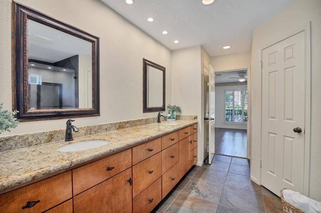 First floor Master Suite with Columbia Intuition Cocoa Pecan hardwood floors done in 2013, large window, plantation shutters, crown molding - this room faces the front of the house and is private from all the other bedrooms which are upstairs.