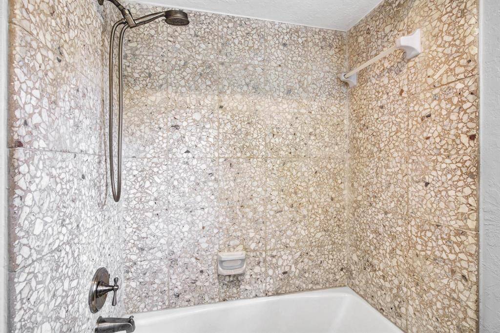 Upstairs full bath 1 - These floors are travertine tile and blend perfectly