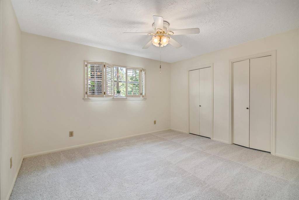 Secondary upstairs bedroom 2 with joining closet - big windows, new carpet..
