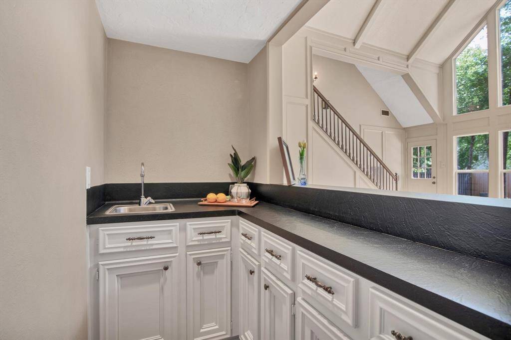Wet bar with plenty of counter and cabinet space