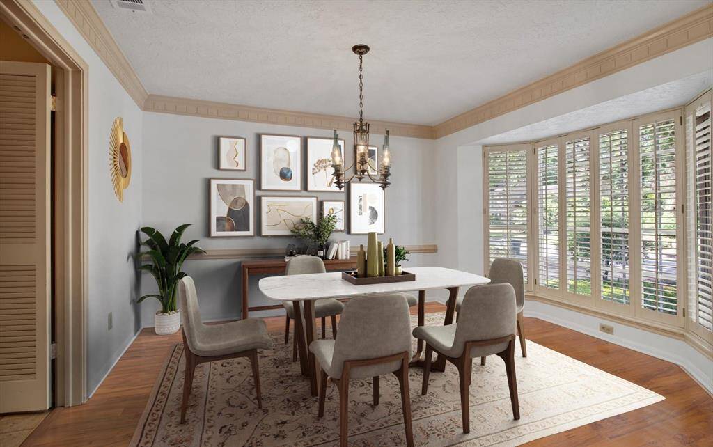 Formal dining easily accessible to the kitchen.  Plantation shutters are throughout the entire home