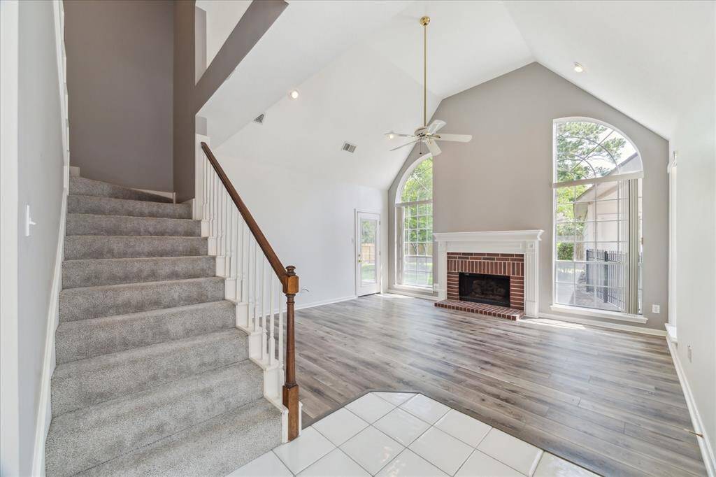 Located just off the kitchen, this family room is perfect for enjoying family and friends.  The door go right out to the patio.