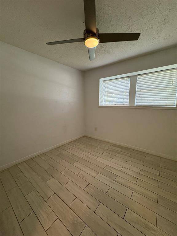 Second bedroom with a lot of natural lighting.