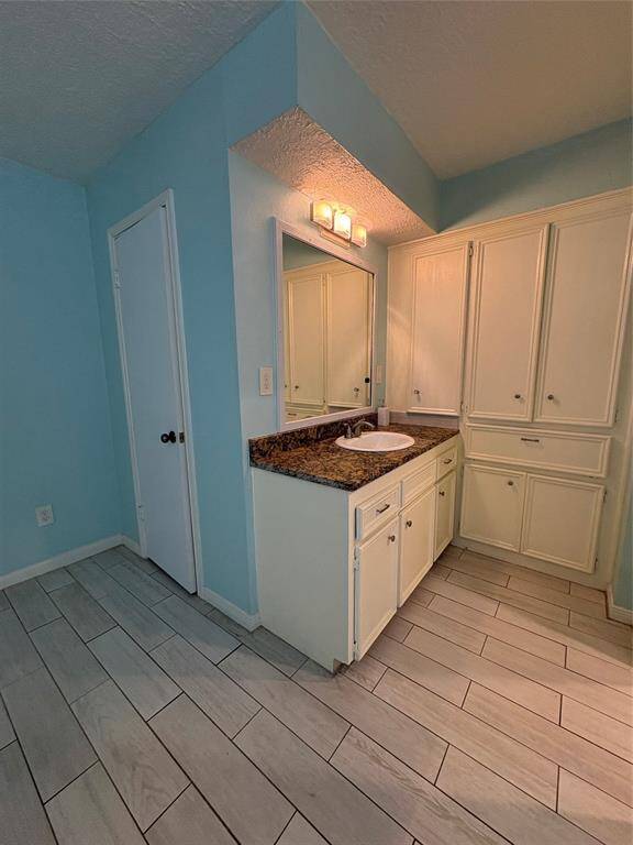 Granite counter tops with lots of cabinet space.