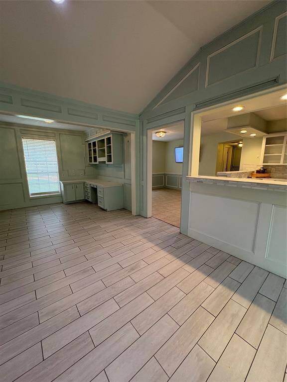 Stone and ceramic countertops, and ugraded tile through out the kitchen, with a tv installed already.