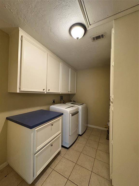 Washer and dryer included in the laundry room.