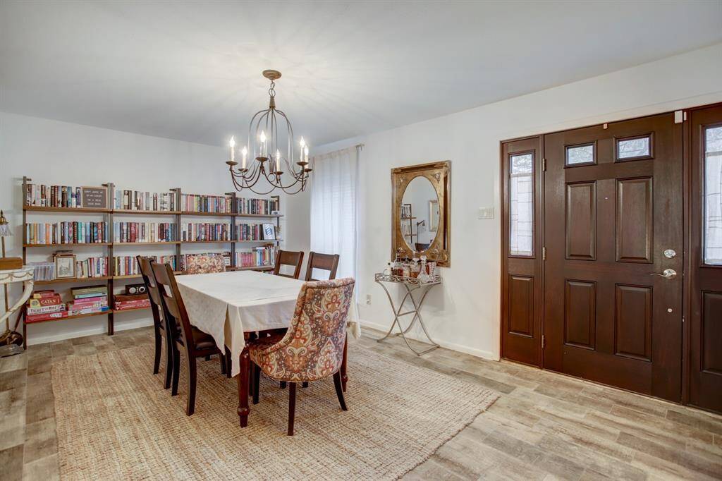 First of two living/dining areas as you enter the home.