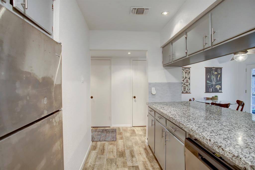 As you look into the hall note the two storage closets perfect for pantry space and appliance storage.