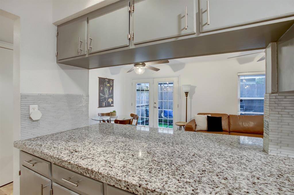 Open kitchen looking into additional living space.