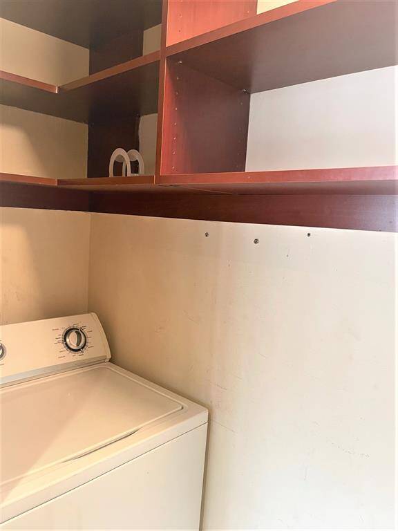 Laundry washer with open shelving above