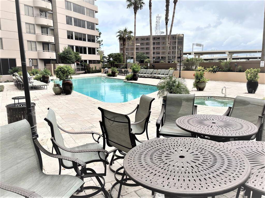 Plenty of tables and chairs poolside