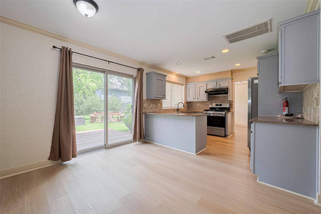 Kitchen with sliding doors to backyard