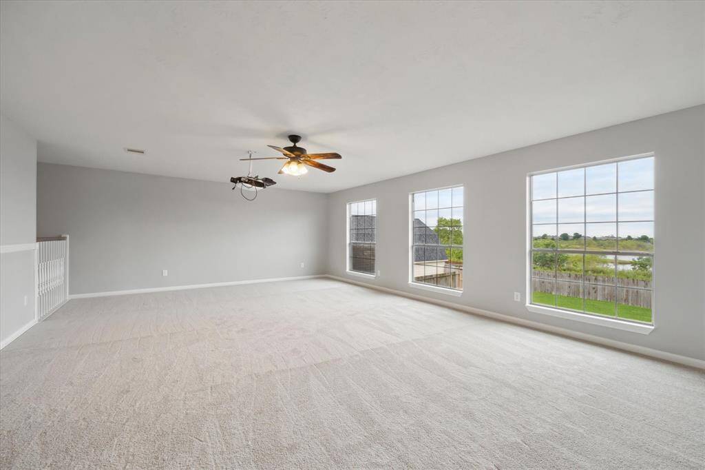 Upstairs game room with views of the pond behind the house.