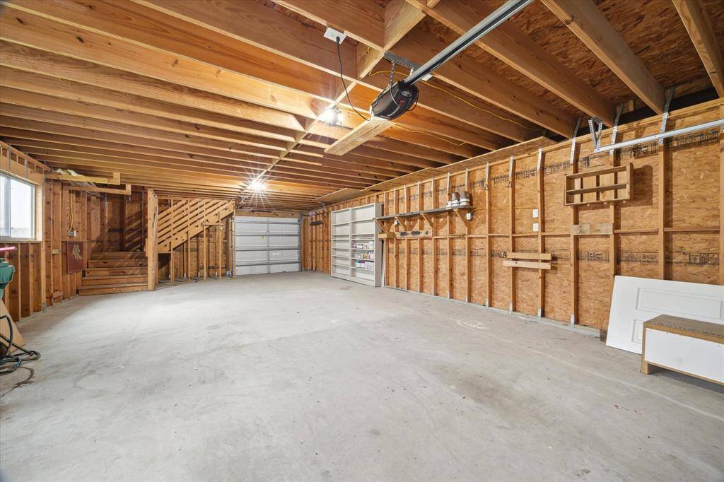 4 car garage or additional space for workshop. Extra garage door in back!