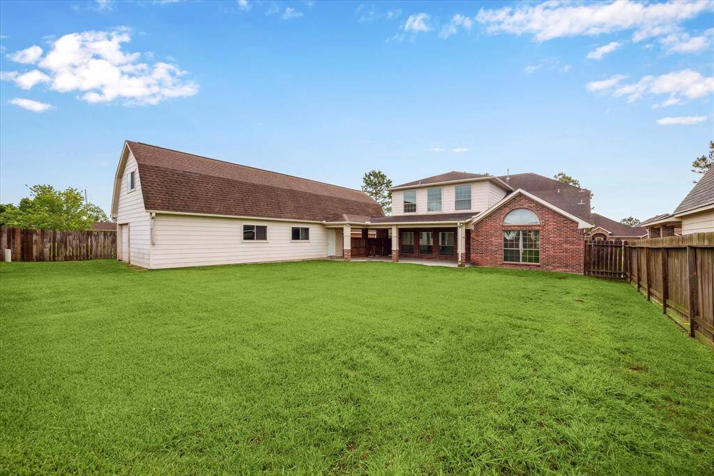 Huge backyard with covered patio.