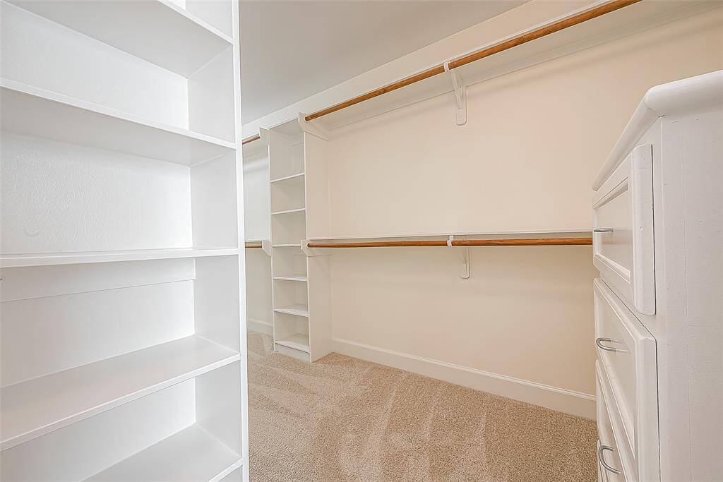 Generously sized walk-in closet.