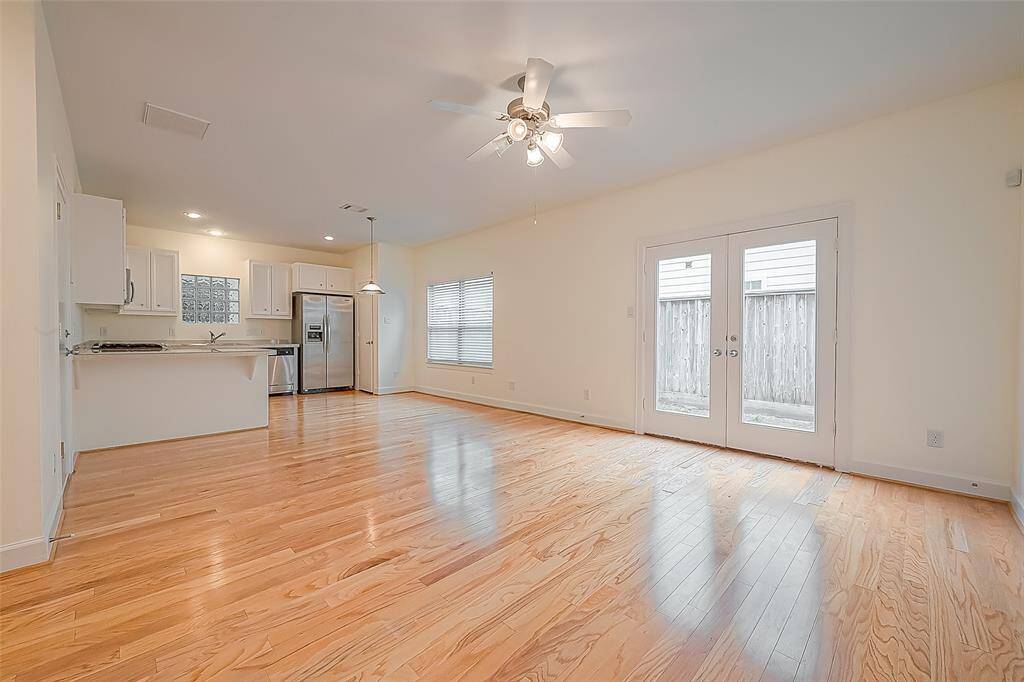 Enjoy the open flow of this living space, seamlessly connected to the kitchen, creating a welcoming atmosphere that encourages interaction and makes entertaining a breeze.