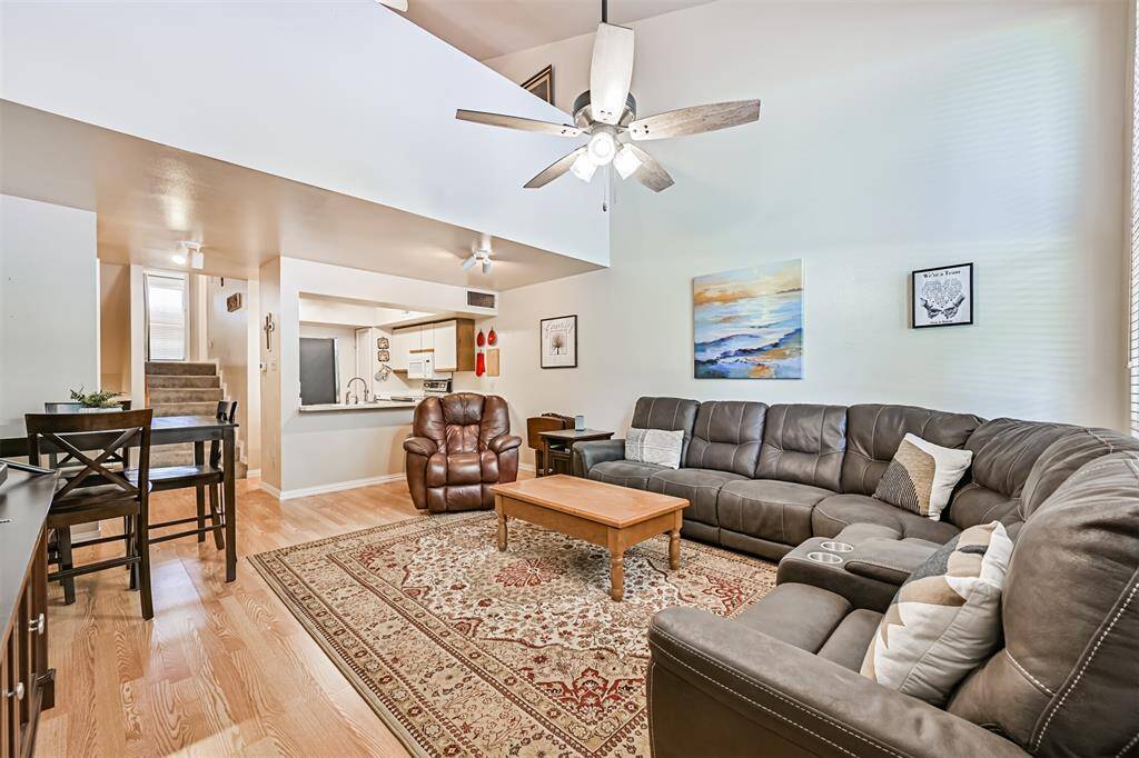 Spacious living area with updated laminate flooring and neutral tones, ideal for any decorating style.