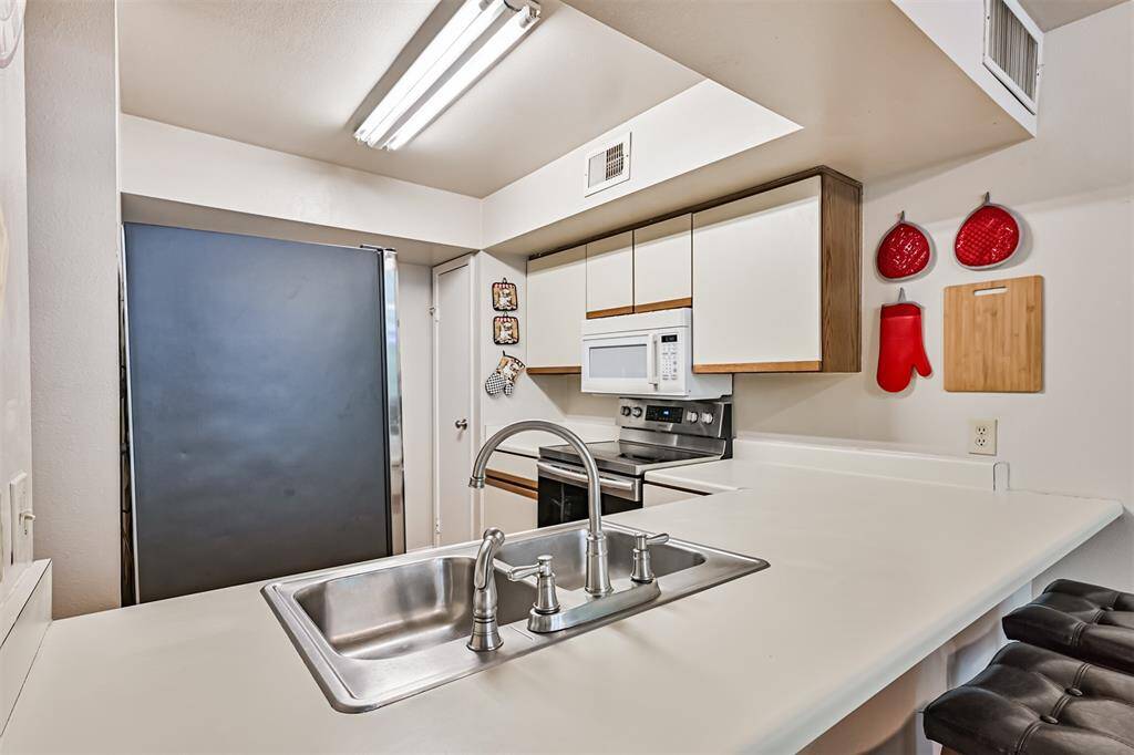 Well-appointed kitchen with ample cabinetry and countertop space for all your cooking needs.