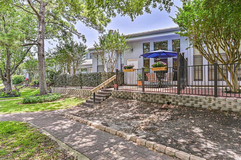 nestled under mature trees that provide plenty of shade and privacy.