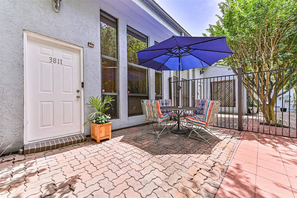 A quiet, tree-lined patio offers a calm space for entertaining, reading, or simply unwinding after a long day.