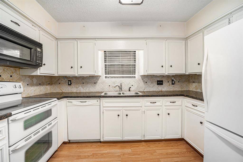 Closer look at this kitchen with a double oven.