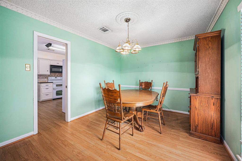 Bright formal dining room off the living room with access to the kitchen.