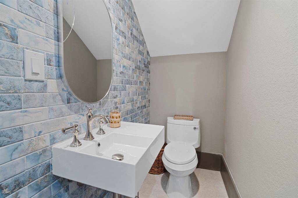 Half bath located on the ground floor of the home.  Details, details... look at that tile!