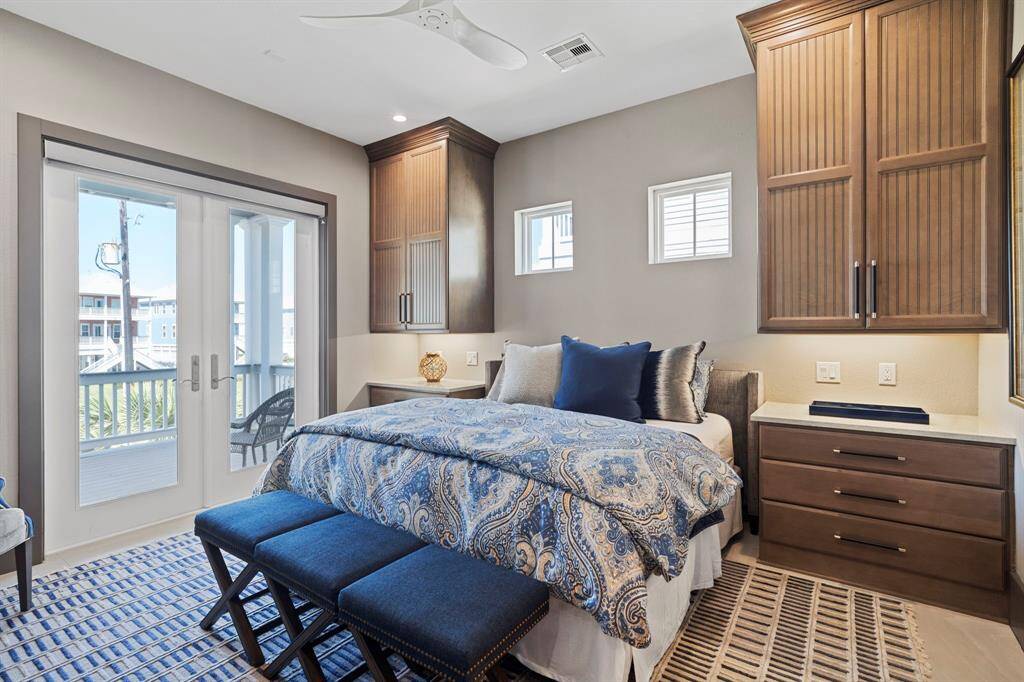 Secondary bedroom on the second floor with balcony access.