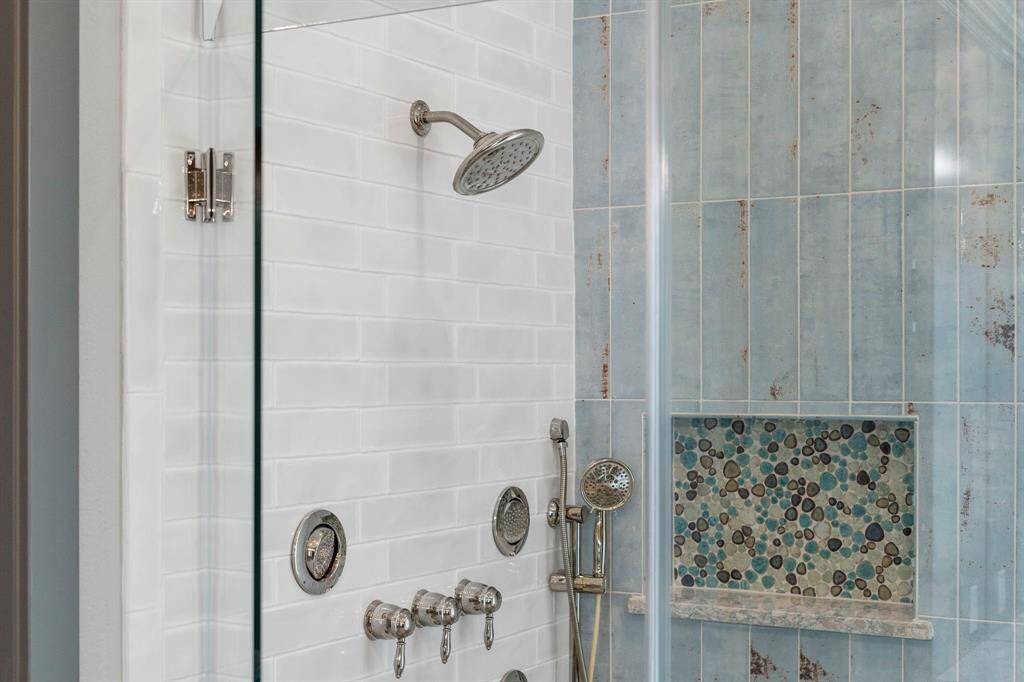 Multi-head shower system and fully tiled shower.