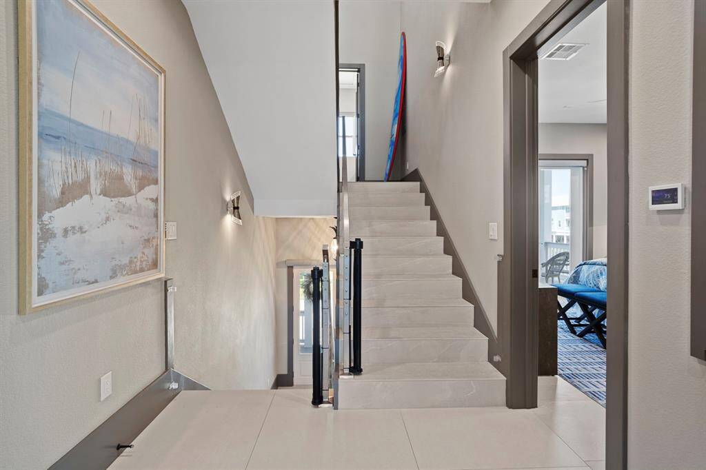 2nd floor landing, stairs going up to 3rd floor.