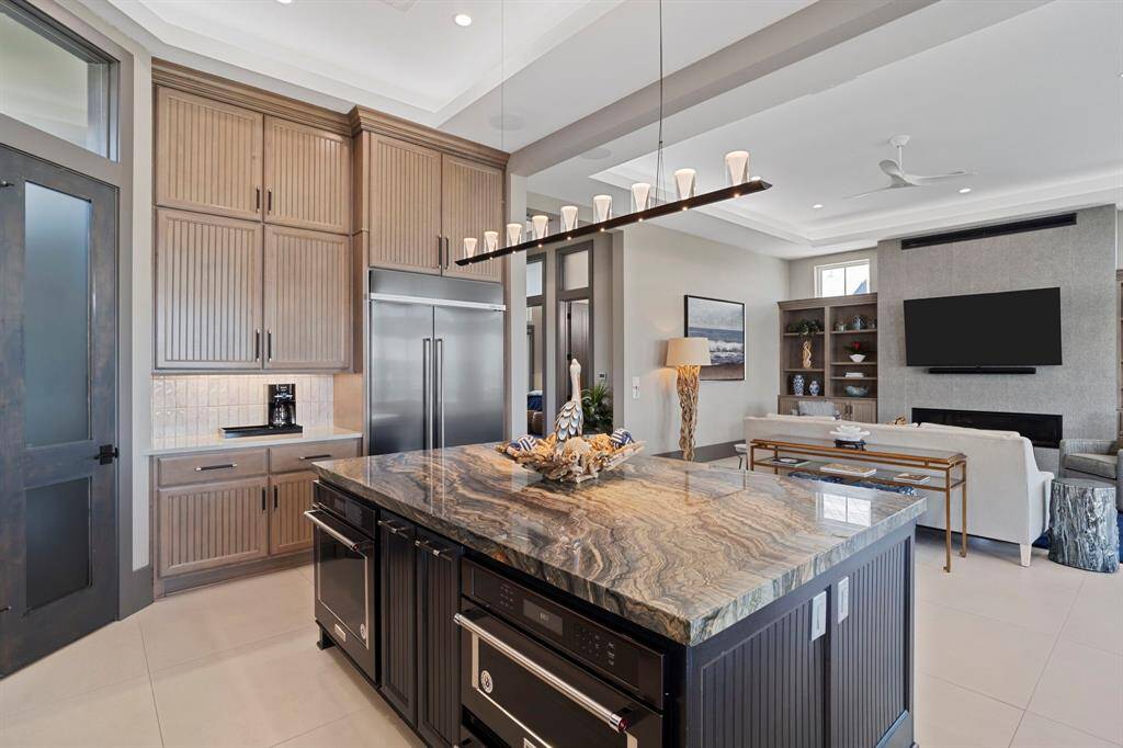 The kitchen/living and dining/breakfast areas are located on the 3rd floor of the home.  Additional oven, warming oven and microwave installed in oversized island.
