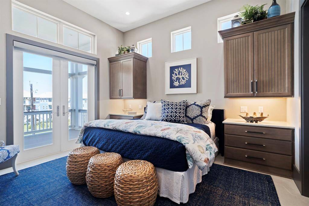 One of two secondary bedrooms on the 3rd floor with access to the balcony.